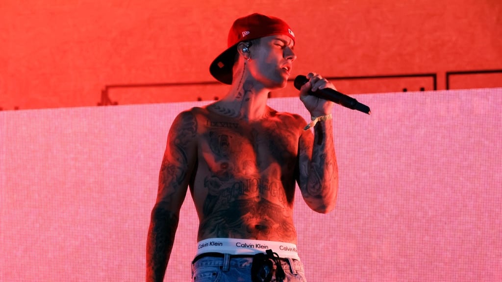 Justin Bieber performing on stage.