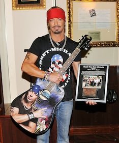 NEW YORK, NY - JULY 18:  Singer/TV personality Bret Michaels poses for a photo with the guitar he donated to Hard Rock Cafe at Hard Rock Cafe New York on July 18, 2014 in New York City.  (Photo by Stephen Lovekin/Getty Images)